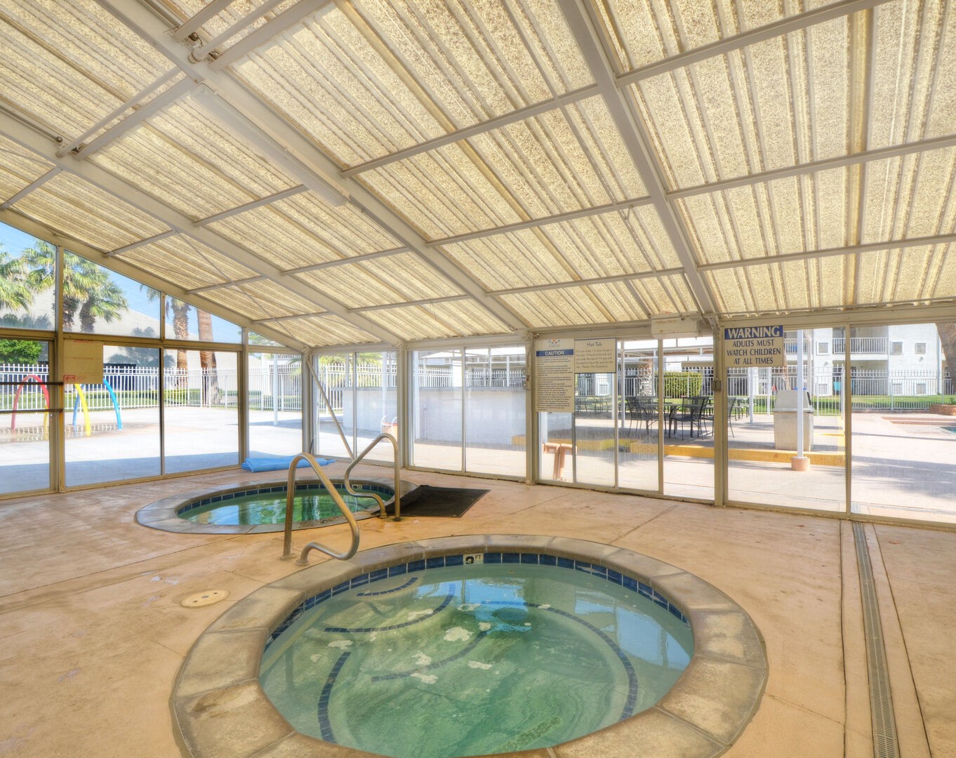 Hot tubs in covered area behind Club House.