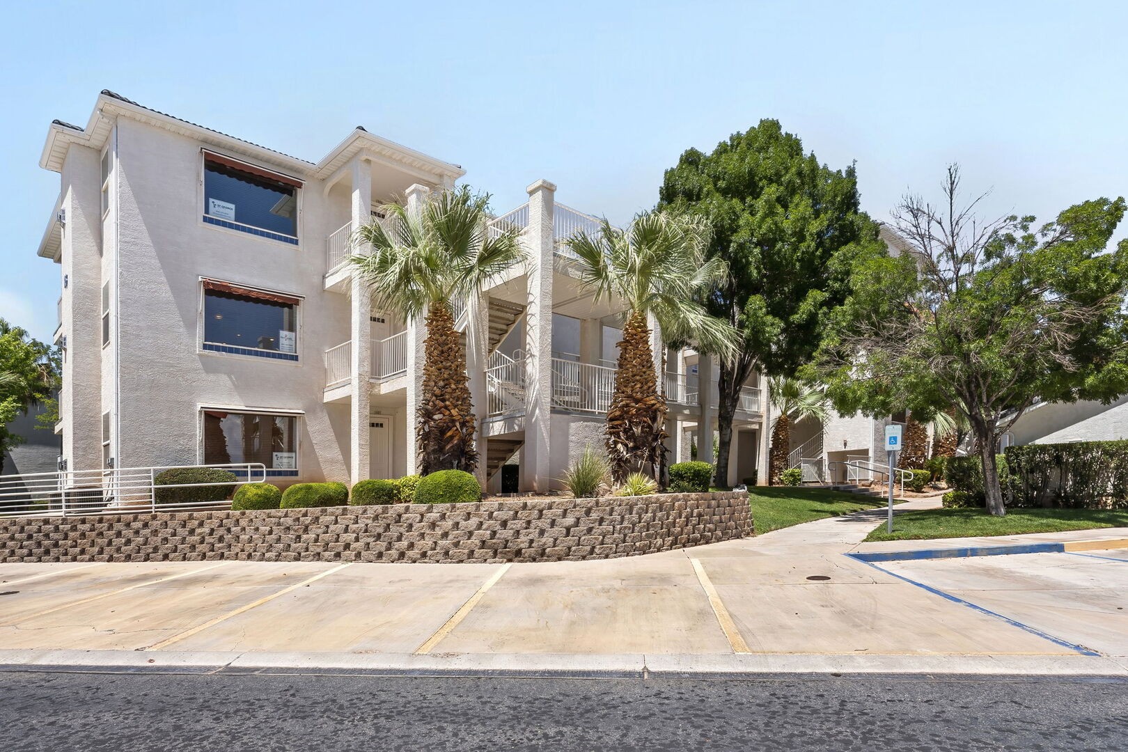 View of condo (second floor on left) from parking area.