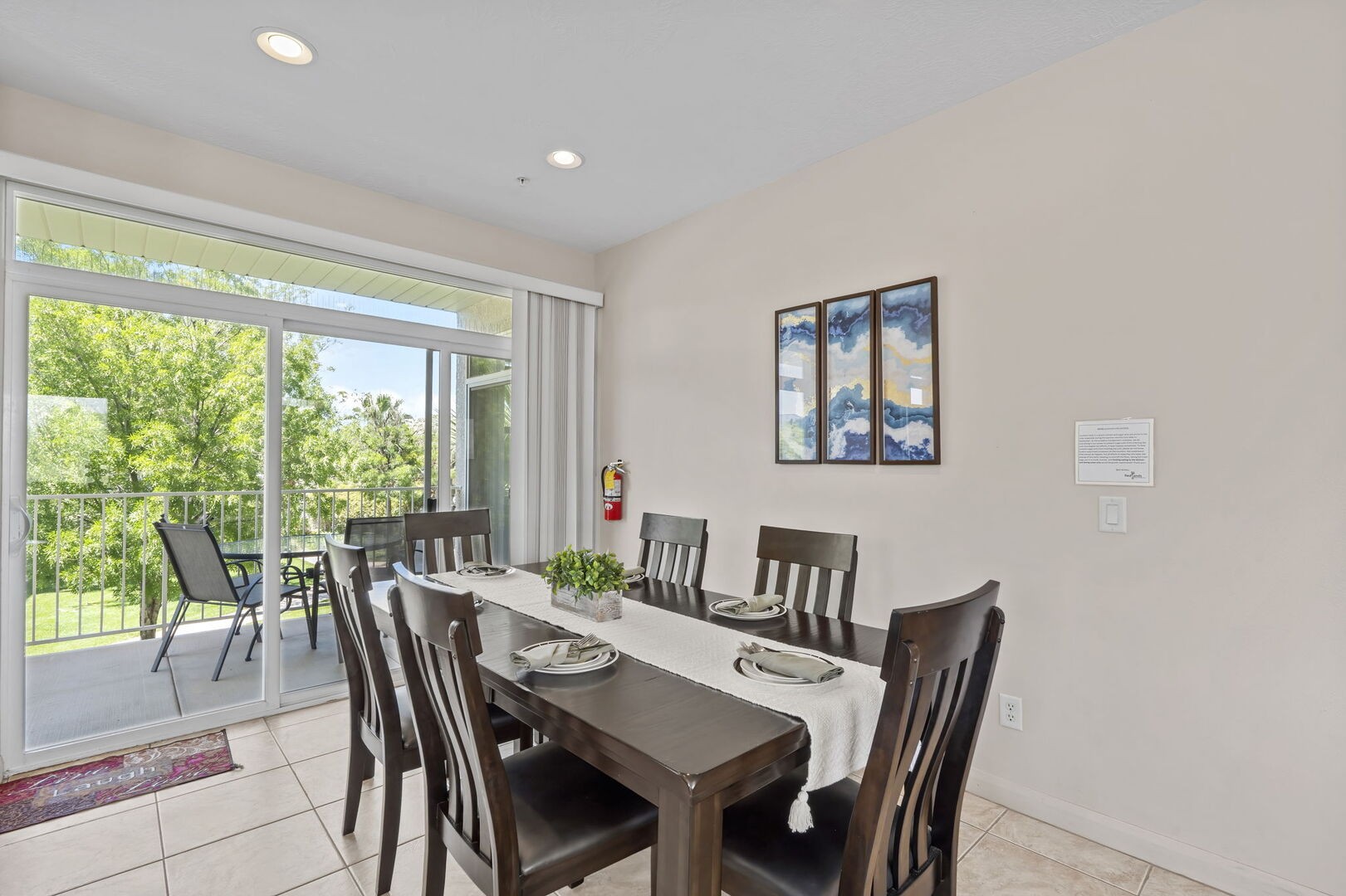 Dining area with table that will seat eight with the bench from the foyer.